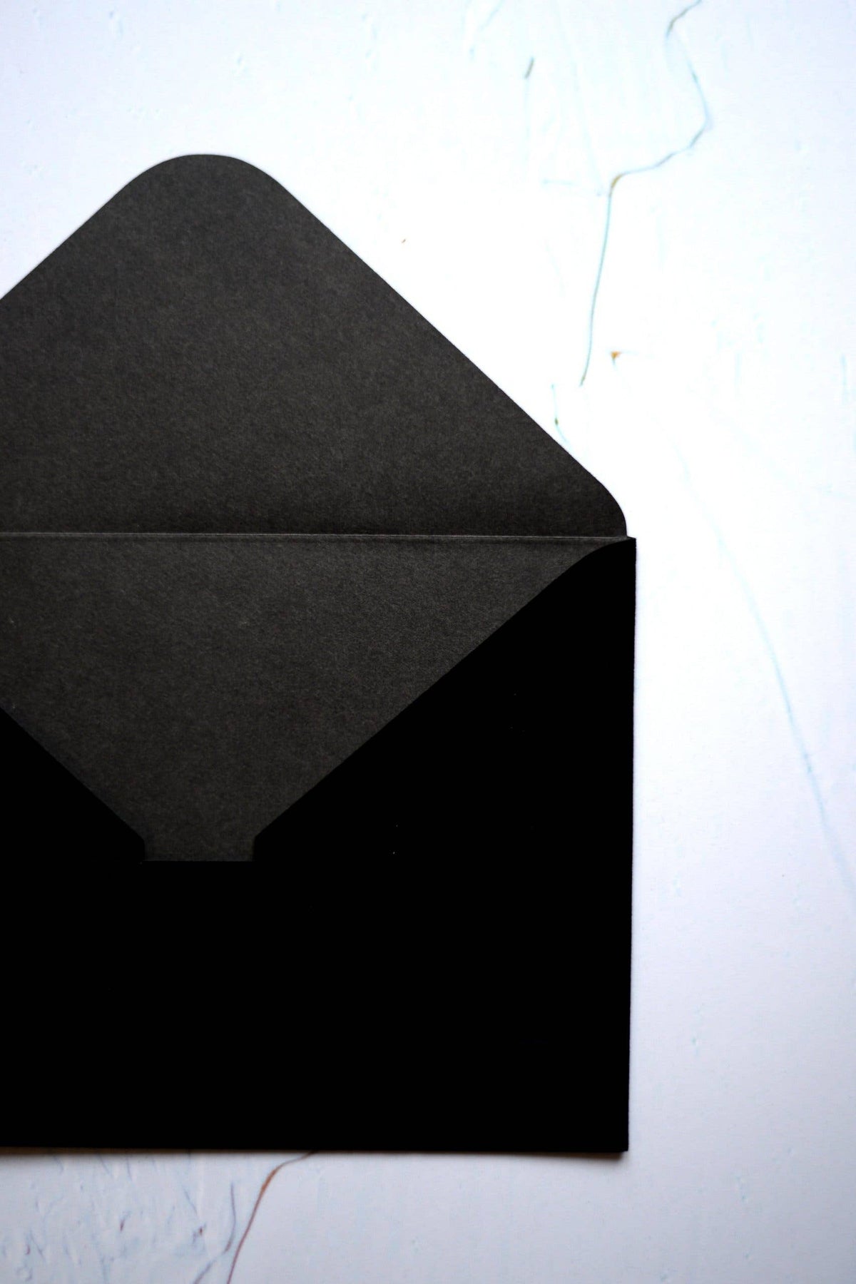 Close-up of a black velvet paper envelope