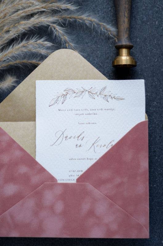 Old rose velvet paper envelope with elegant wedding invitation