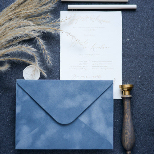 Vintage blue velvet paper envelope with elegant wedding stationery