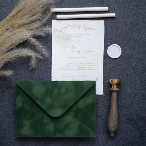 Dark green velvet paper envelope with soft textured surface