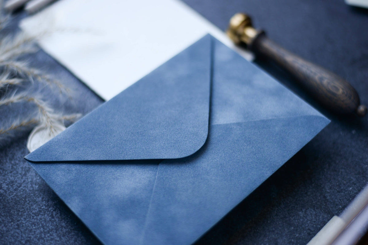 Close-up of a vintage blue velvet paper envelope