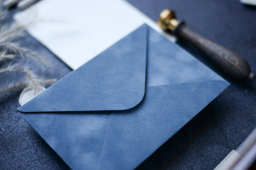 Close-up of a vintage blue velvet paper envelope