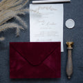 Wine red velvet paper envelope with elegant wedding stationery
